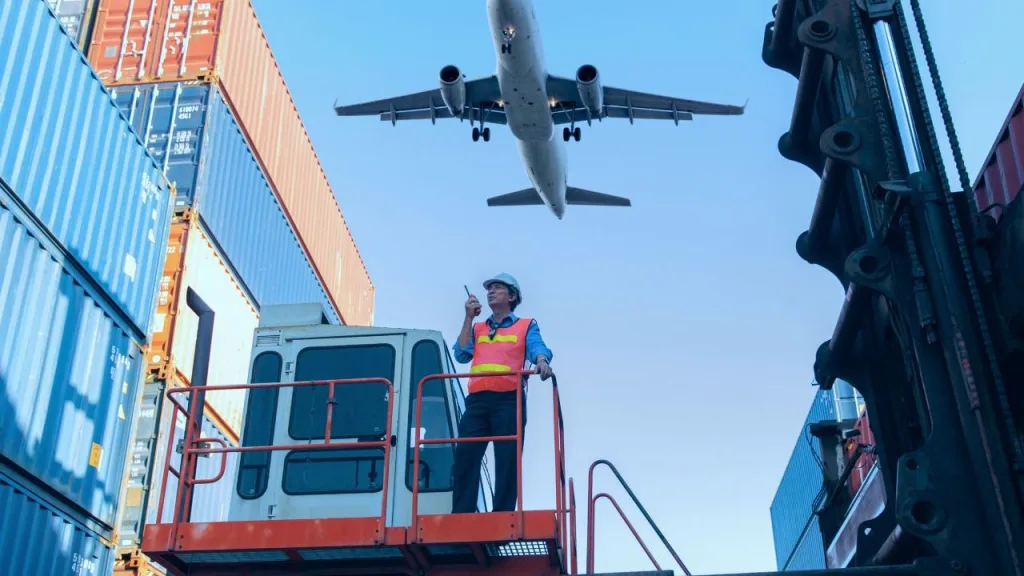Logistics professionals handling cargo operations with air freight transportation support